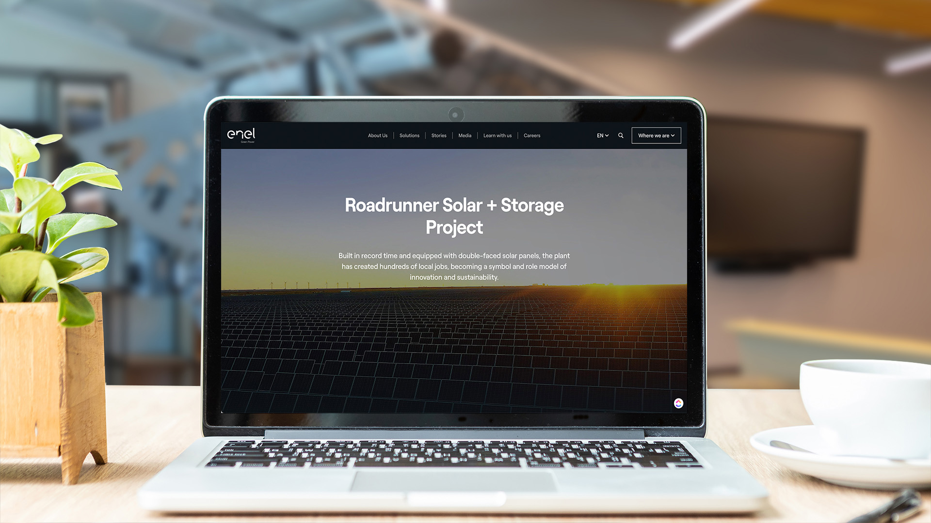 A laptop showing an image of solar panels with the words Roadrunner Solar + Storage project