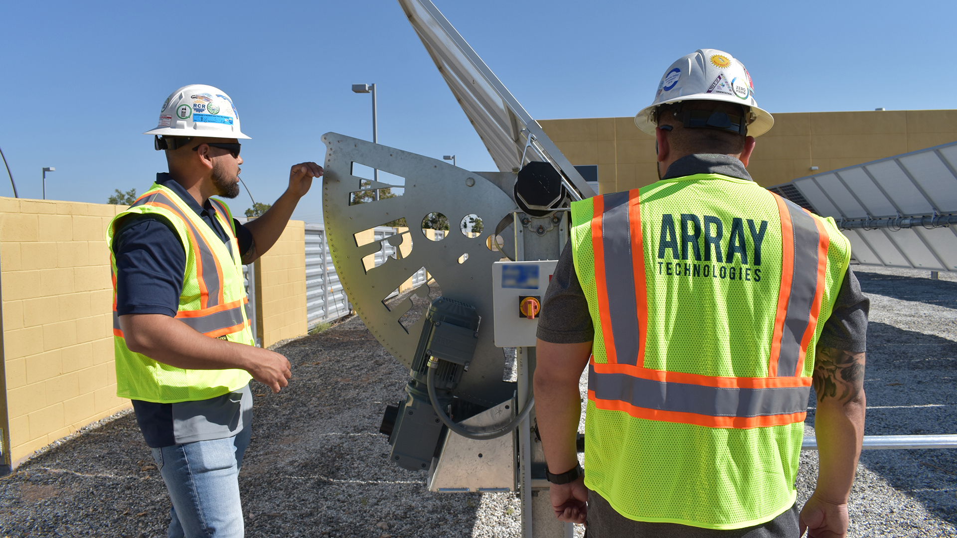 Array workers looking at an Array tracker