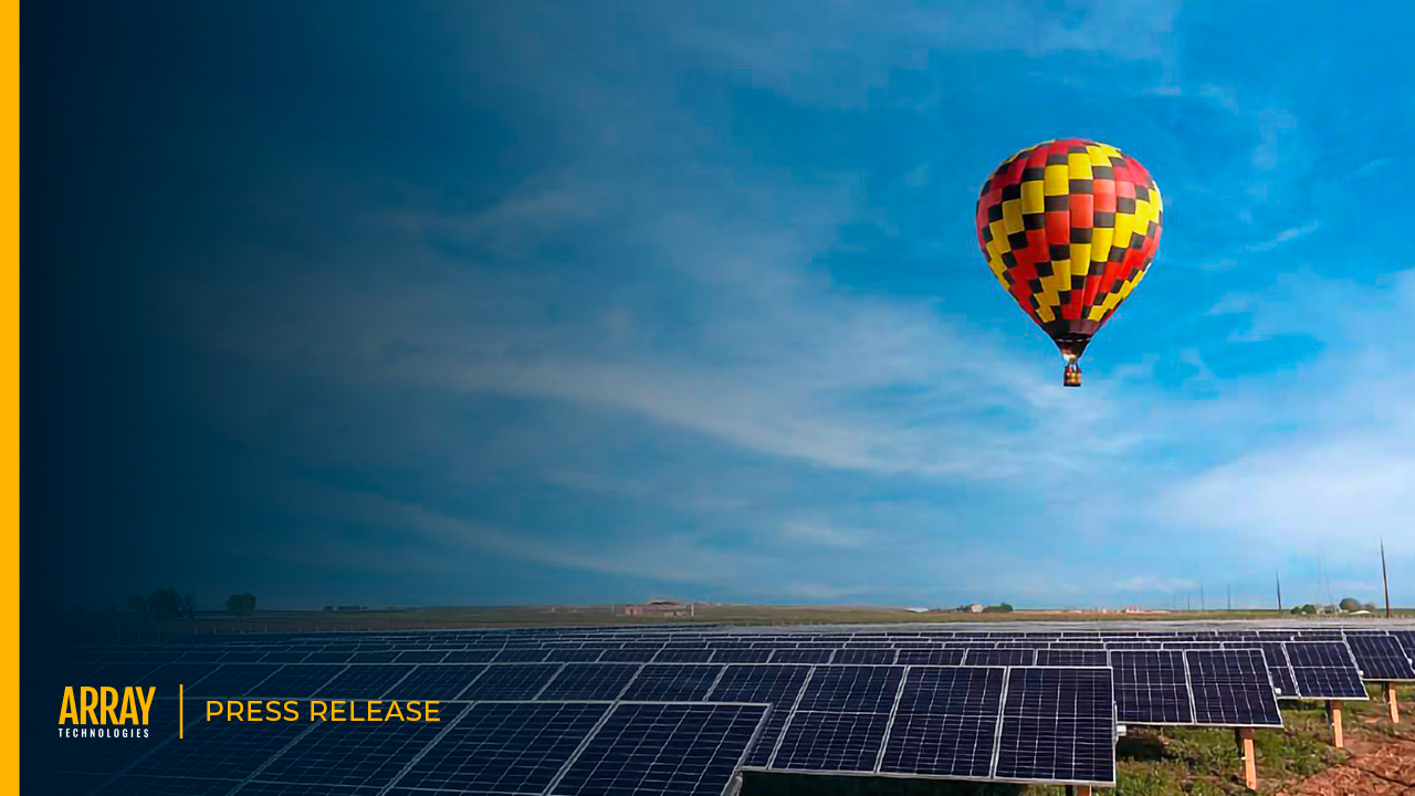 A press release cover image with a hot air balloon in the sky above a rows of solar panels