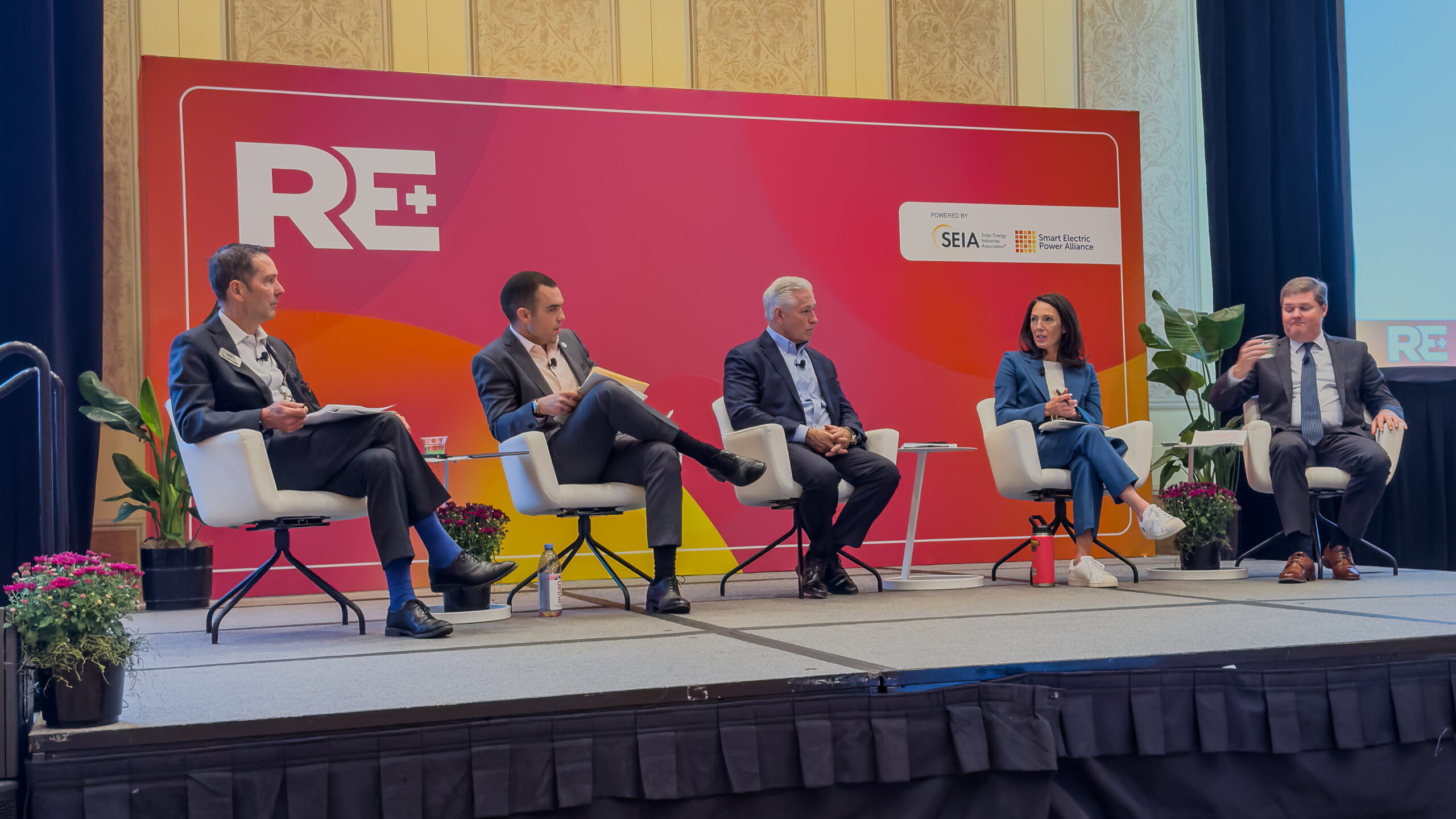 ARRAY's Jessica Lawrence-Vaca sitting on the Federal Policy Update: Tax Incentives, Trade, Tariffs, and Other Goings-On in Washington panel at RE+ 2025 Day 1 of the trade show September 10, 2025